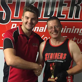 Expert PT gives their client an award