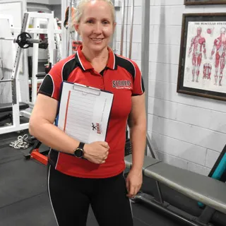 Personal Trainer holding body scan results