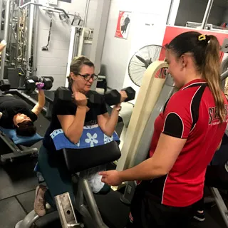 Fitness coach conducting a PT session