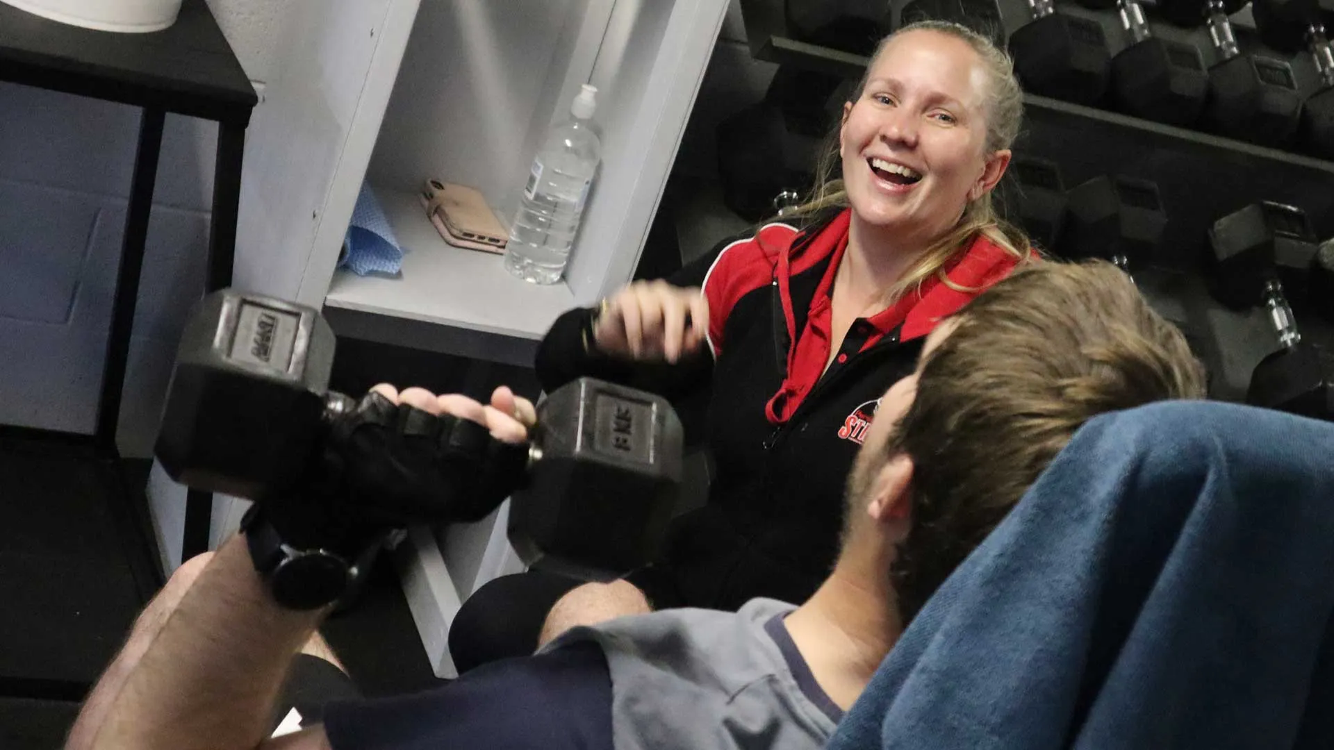 Happy female Personal Trainer in a Brisbane Gym