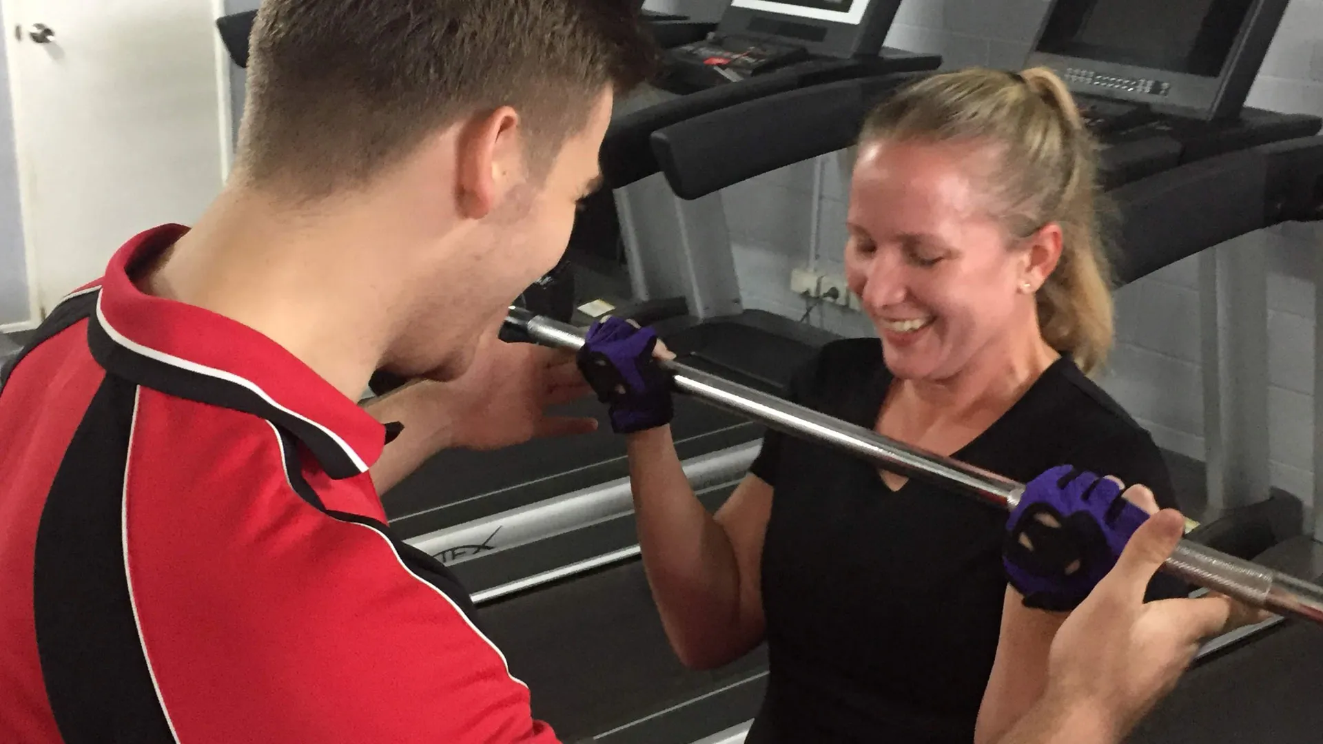 Male Striders Personal Trainer with a smiling female client